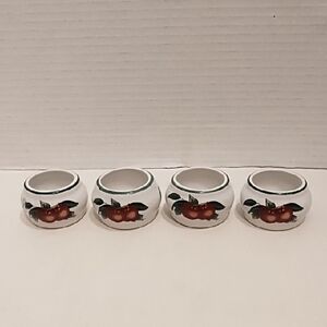 Set of 4 White Ceramic Napkin Rings with Red Apple Design